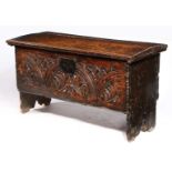 A CHARLES I CARVED OAK AND ELM BOARDED CHEST, WEST COUNTRY, CIRCA 1630, WITH RARE CHARLES II PRINTED