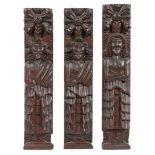 A SET OF THREE ELIZABETH I OAK FIGURAL TERMS, CIRCA 1600.