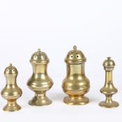 A GROUP OF FOUR GEORGE III CAST BRASS CASTERS OR PEPPERETTES, CIRCA 1780-1800.