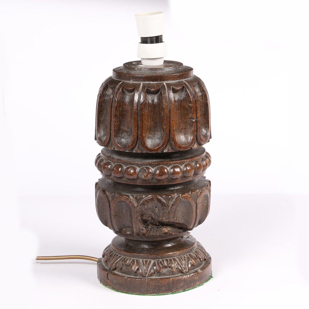 AN OAK TABLE LAMP, FORMED FROM AN ELIZABETH I CARVED OAK BED-POST SECTION, CIRCA 1580.