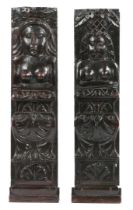 A PAIR OF JAMES I/CHARLES I OAK CARVED FIGURAL TERMS, CIRCA 1610-30.