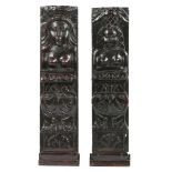 A PAIR OF JAMES I/CHARLES I OAK CARVED FIGURAL TERMS, CIRCA 1610-30.