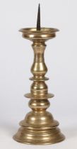 A 16TH CENTURY BRASS PRICKET CANDLESTICK, PROBABLY NUREMBERG, CIRCA 1600.