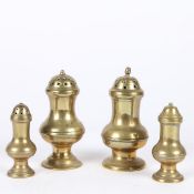 A GROUP OF FOUR GEORGE III BRASS CASTERS OR PEPPERETTES, CIRCA 1770-1800.