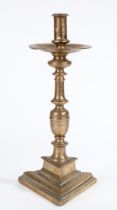 A 17TH CENTURY BRASS ('BELL-METAL') SOCKET CANDLESTICK, SPANISH.