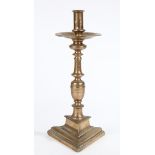 A 17TH CENTURY BRASS ('BELL-METAL') SOCKET CANDLESTICK, SPANISH.