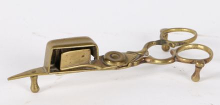 A GEORGE III BRASS CANDLE-SNUFFER, CIRCA 1800.