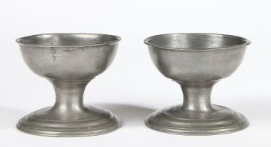 A VERY NEAR PAIR OF GEORGE III PEWTER CUP SALTS, CIRCA 1770.