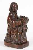 A GOOD 16TH CENTURY CARVED OAK FIGURE OF A MALE MUSICIAN.