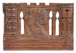 AN UNUSUAL HENRY VIII OAK CARVED AND PIERCED PORTRAIT PANEL, CIRCA 1540.