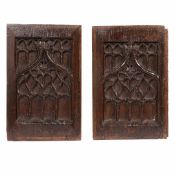 A PAIR OF 15TH CENTURY OAK TRACERY CARVED PANELS, CIRCA 1450-80.