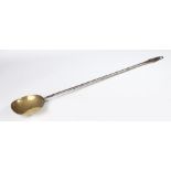 AN EARLY 18TH CENTURY BRASS AND IRON STRAINING LADLE, ENGLISH, CIRCA 1720-50.