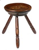 AN EARLY 19TH CENTURY SYCAMORE AND OAK DAIRY STOOL, WELSH, CIRCA 1800-40.