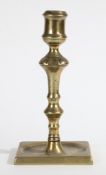 A GEORGE II BRASS SOCKET CANDLESTICK, CIRCA 1740.