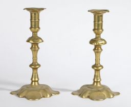 A PAIR OF GEORGE II BRASS SOCKET CANDLESTICKS, CIRCA 1755.