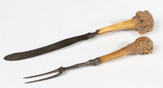 A GEORGE II IRON AND ANTLER KNIFE AND FORK, CIRCA 1750.