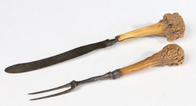 A GEORGE II IRON AND ANTLER KNIFE AND FORK, CIRCA 1750.