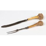 A GEORGE II IRON AND ANTLER KNIFE AND FORK, CIRCA 1750.