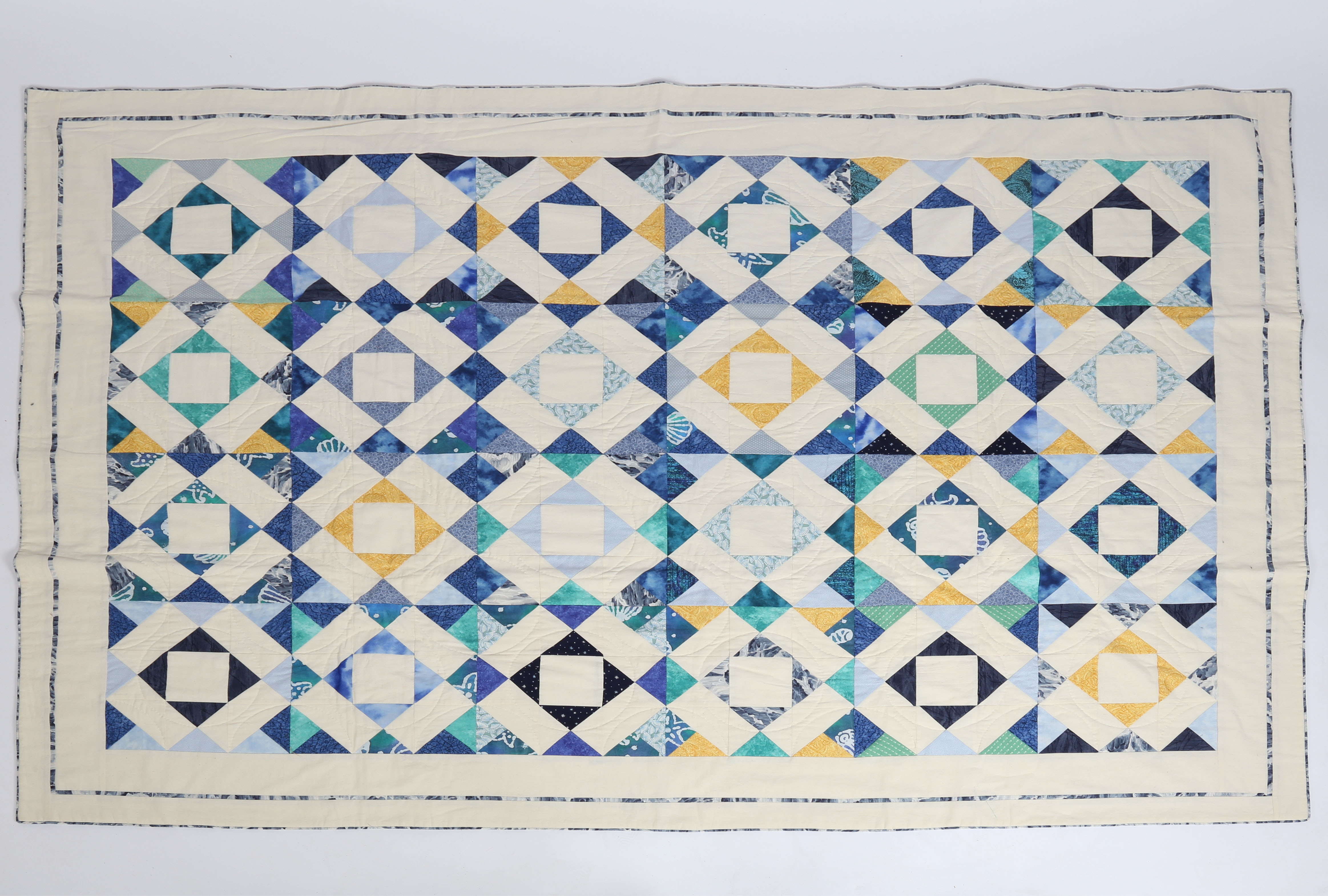 A STUNNING BLUE HANDMADE PATCH WORK QUILT