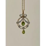 Diamond and Peridot Bow Pendant on Gold Chain