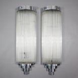 Ein Paar Wandlampen im Art Déco-Stil - 20. Jh., verchromte Metallmontur mit jeweils 38 eingesetzten