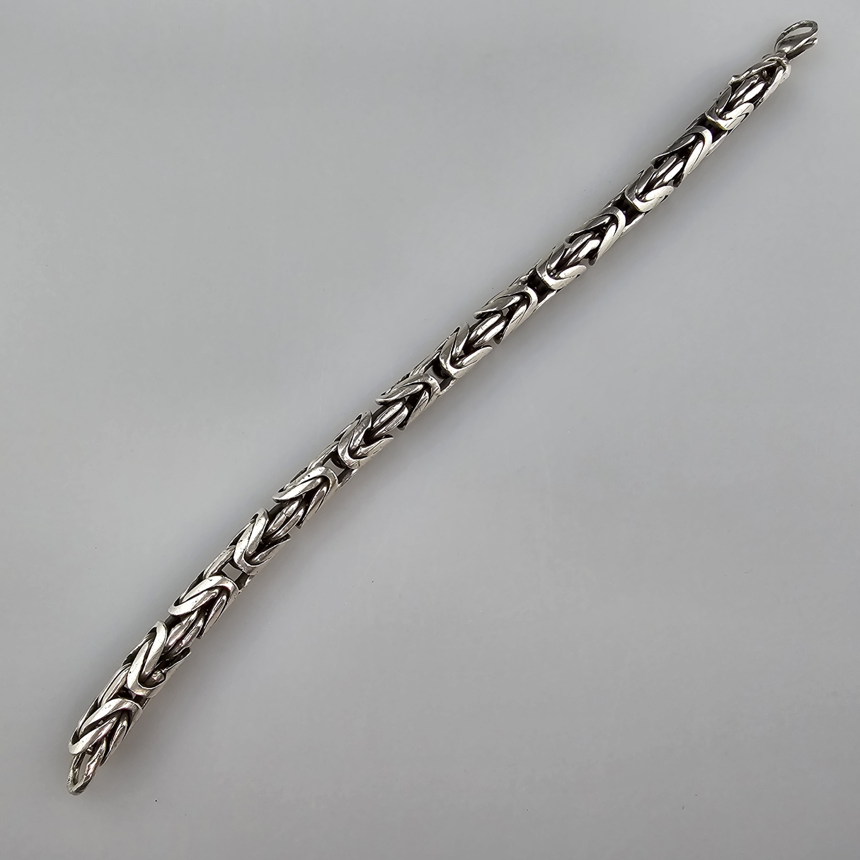 Königsarmband - Sterlingsilber, "925"gestempelt, Karabinerschließe, L. 23 cm, Dm. 7mm, Gewicht ca.