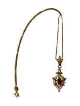 GORGEOUS 18 CARAT GOLD PENDANT SET WITH AQUAMARINE, GARNET, SEED PEARLS AND DIAMONDS. WEIGHT 3.7G ON