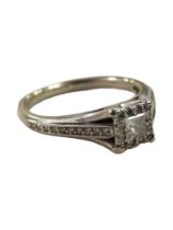 9 CARAT WHITE GOLD DIAMOND RING WITH 0.25 CARAT OF DIAMONDS