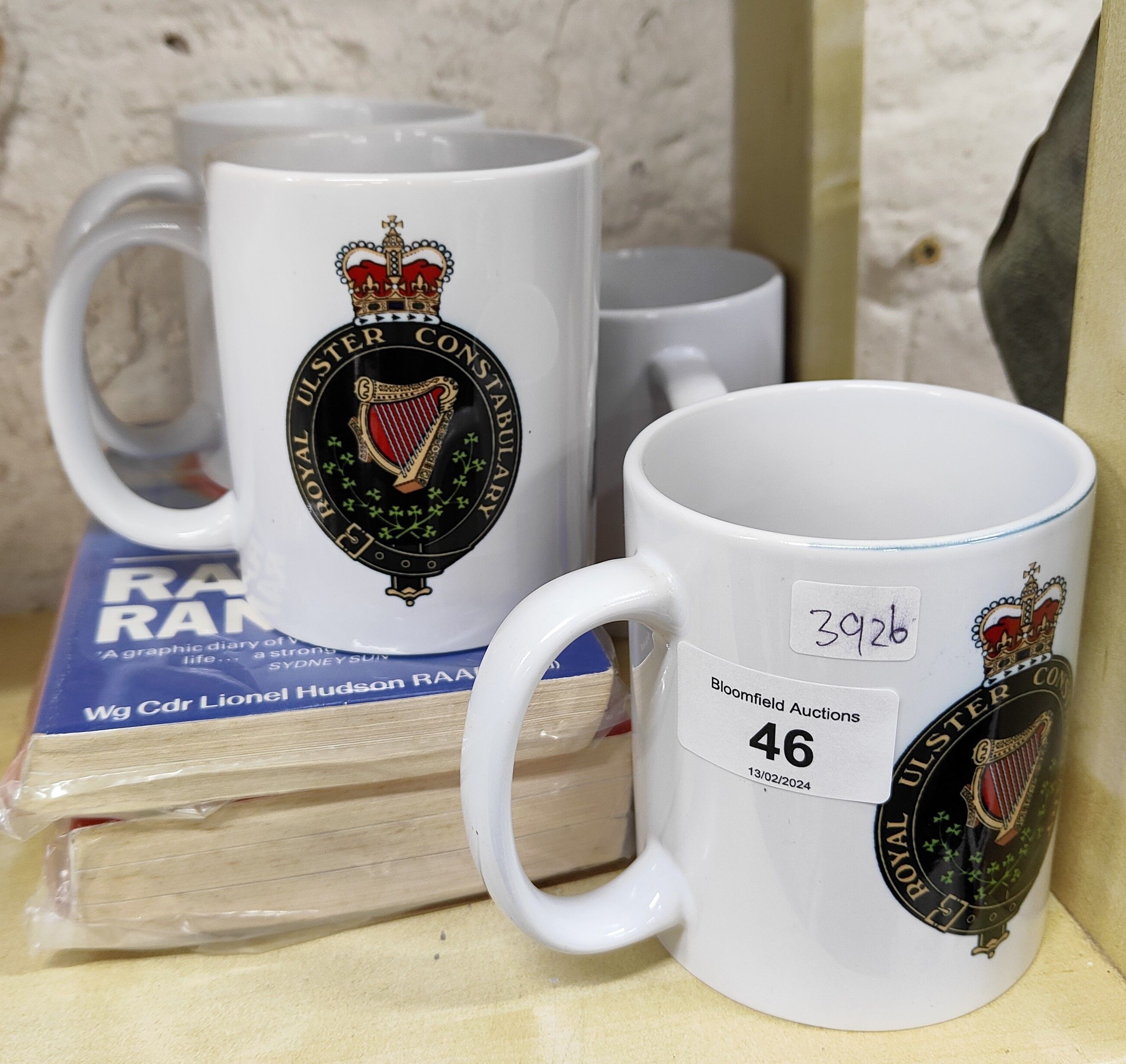 4 ROYAL ULSTER CONSTABULARY MUGS AND 2 BOOKS