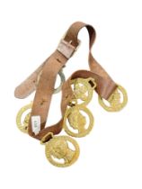COLLECTION OF OLD COMMEMORATIVE HORSE BRASSES ON LEATHER BELT