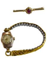 9 CARAT GOLD BROOCH AND 9 CARAT GOLD CASED WATCH