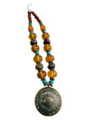 UNUSUAL TURQUOISE WHITE METAL PENDANT ON AMBER BEADED NECKLACE