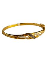 YELLOW METAL BLACK AND WHITE DIAMOND BANGLE