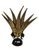 ORNATE MASK ON METAL BASE