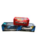 3 BOXED LARGER SCALE MODEL CARS