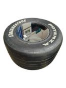 FORMULA 1 RACING TYRE WITH TOUGHENED GLASS AS IT WAS BEING USED AS A COFFEE TABLE