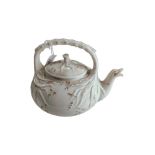 1ST PERIOD GRASS PATTERN BELLEEK TEAPOT - A NUBER OF HAIRLINE CRACKS TO HANDLE AND AROUND BASE OF