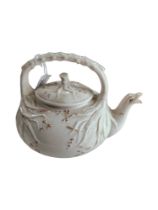 1ST PERIOD GRASS PATTERN BELLEEK TEAPOT - A NUBER OF HAIRLINE CRACKS TO HANDLE AND AROUND BASE OF