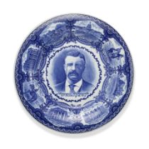 A THEODORE ROOSEVELT STAFFORDSHIRE PLATE. A blue and white dinner plate by The Rowland & Marellu...