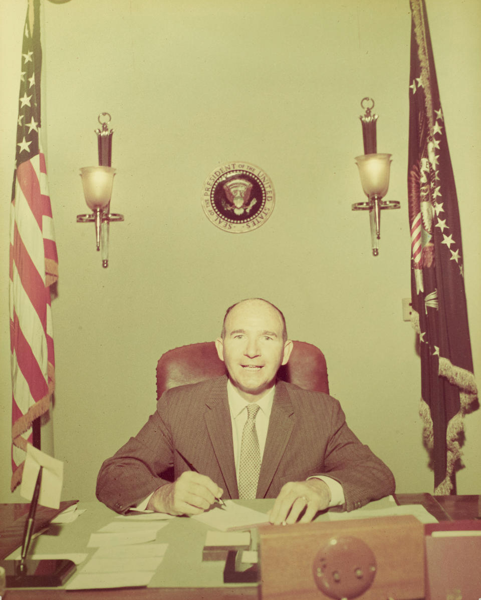 DAVE POWERS AND THE PRESIDENTIAL SEAL. Photograph, 13.3 x 10.5 in color print by Cecil Stoughton