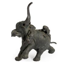 A BRONZE ELEPHANT WITH TWO TIGERS