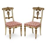 A PAIR OF NEOCLASSICAL STYLE PARCEL GILT PAINTED CARVED SIDE CHAIRS19th century