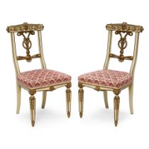 A PAIR OF NEOCLASSICAL STYLE PARCEL GILT PAINTED CARVED SIDE CHAIRS19th century