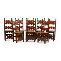 A SET OF EIGHT ITALIAN BAROQUE STYLE WALNUT DINING CHAIRS