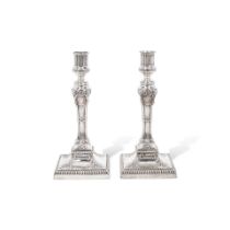 A PAIR OF ENGLISH SILVER NEOCLASSICAL STYLE WEIGHTED CANDLESTICKS by William Hutton & Sons Ltd.,...