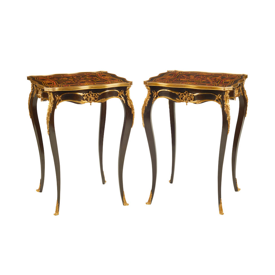 A PAIR OF CONTINENTAL ROCOCO STYLE GILT BRONZE MOUNTED PARQUETRY AND EBONIZED SIDE TABLES