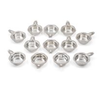 A SET OF TWELVE AMERICAN STERLING SILVER CREAM SOUP CUPS by Shreve & Co., San Francisco, Califor...