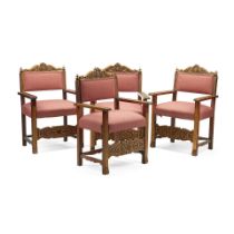 A SET OF FOUR ITALIAN BAROQUE STYLE PARCEL GILT WALNUT OPEN ARMCHAIRS