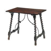 A SPANISH BAROQUE STYLE ELM AND WALNUT PETITE TRESTLE TABLE