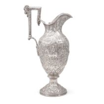 AN AMERICAN STERLING SILVER REPOUSSÉ PITCHER WITH RAM HEAD HANDLE by S. Kirk & Sons, Baltim...